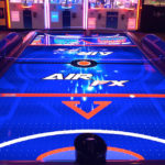 LED Glow Air Hockey Arcade Game from ICE Game Trade Show rental Las Vegas