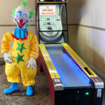 Skeeball with a clown during Bar Mitzvah in Palo Alto arcade event rental by Arcde Party Rental
