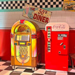 Rockola BubblerCD jukebox with original vintage Vendo Coca Cola vending machine and 50s themed event rented from Arcade Party Rental