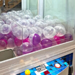 Prize Cube XL 38in claw machine loaded with 4inch capsules Arcade Party Rental