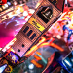 Venom pinball machine detailed image of bell tower Arcade Party Rental