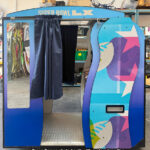 Green Screen photo booth with custom branding for Super Bowl by Arcade Party Rental