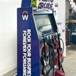 Guitar Hero arcade game with custom branding for convention conference in Las Vegas rental by Arcade Party Rental