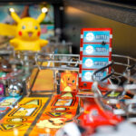 Pikachu and Team Rocket leader in the pinball machine available for hire from Arcade Party Rental San Francisco