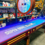 Shuffleboard game with custom branding ready for rental delivery to Super Bowl Santa Clara San Francisco by Arcade Party Rental