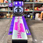 Skeeball arcade game with custom corporate branding for event in Los Angeles by Arcade Party Rental