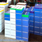 Giant Lego bricks with custom corporate branding ready for delivery to an event from Arcade Party Rental San Francisco
