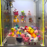 Wonder Claw Prize Crane Machine with shelving for rent from Arcade Party Rental Los Angeles San Diego