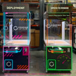 Two Wonder Claw prize crane machine with custom branding and custom overhead backlit signs from Arcade Party Rental